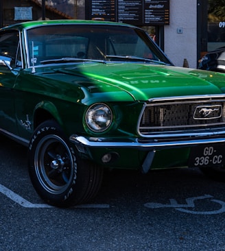 a green mustang parked in a parking lot