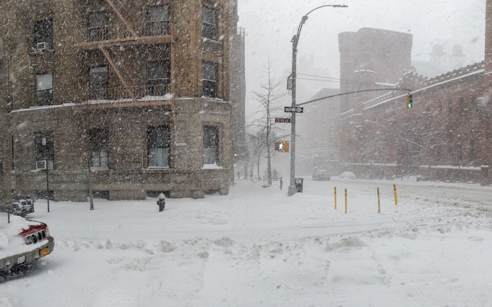 a car driving down a snow covered street