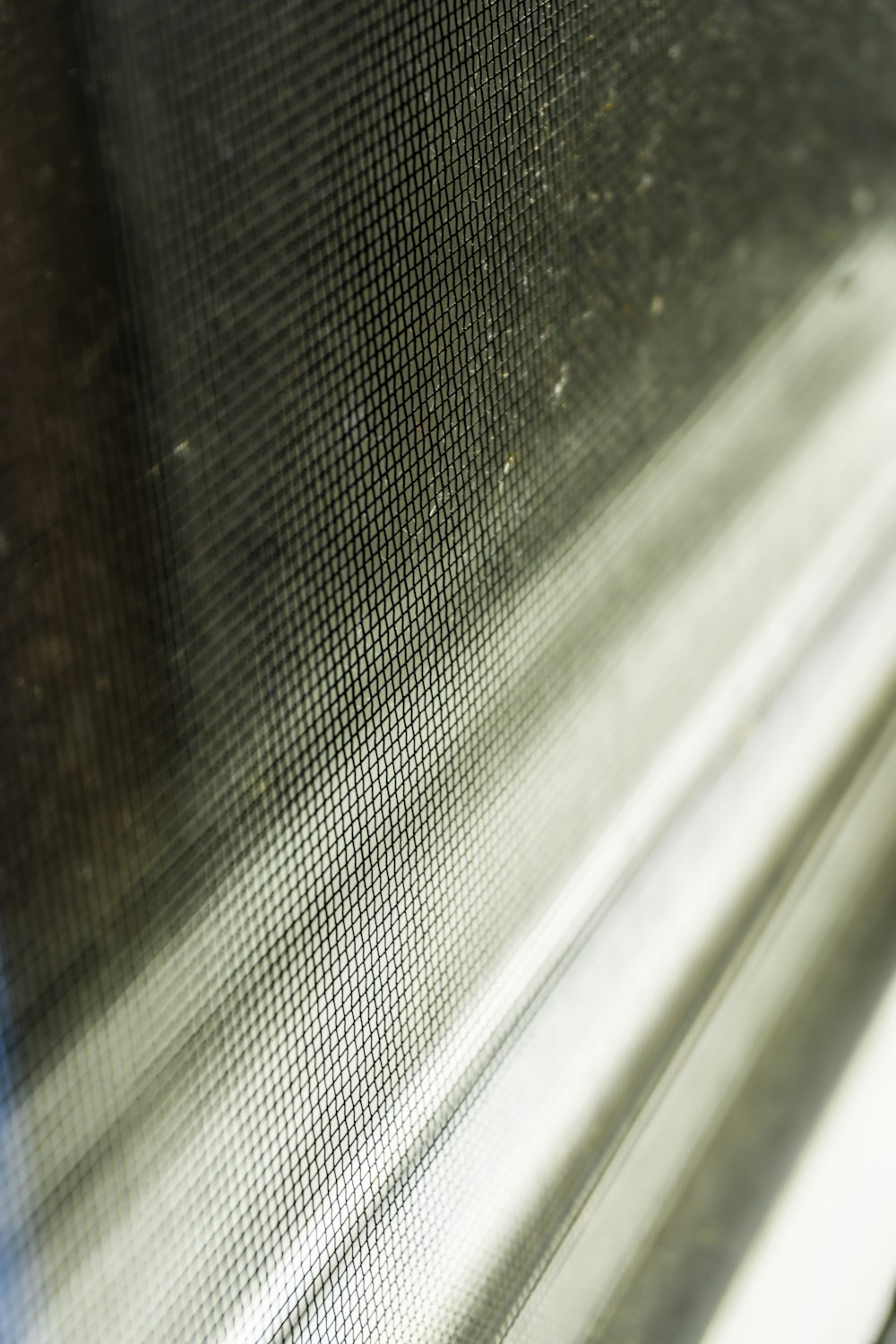 a close up of a window with a blurry background