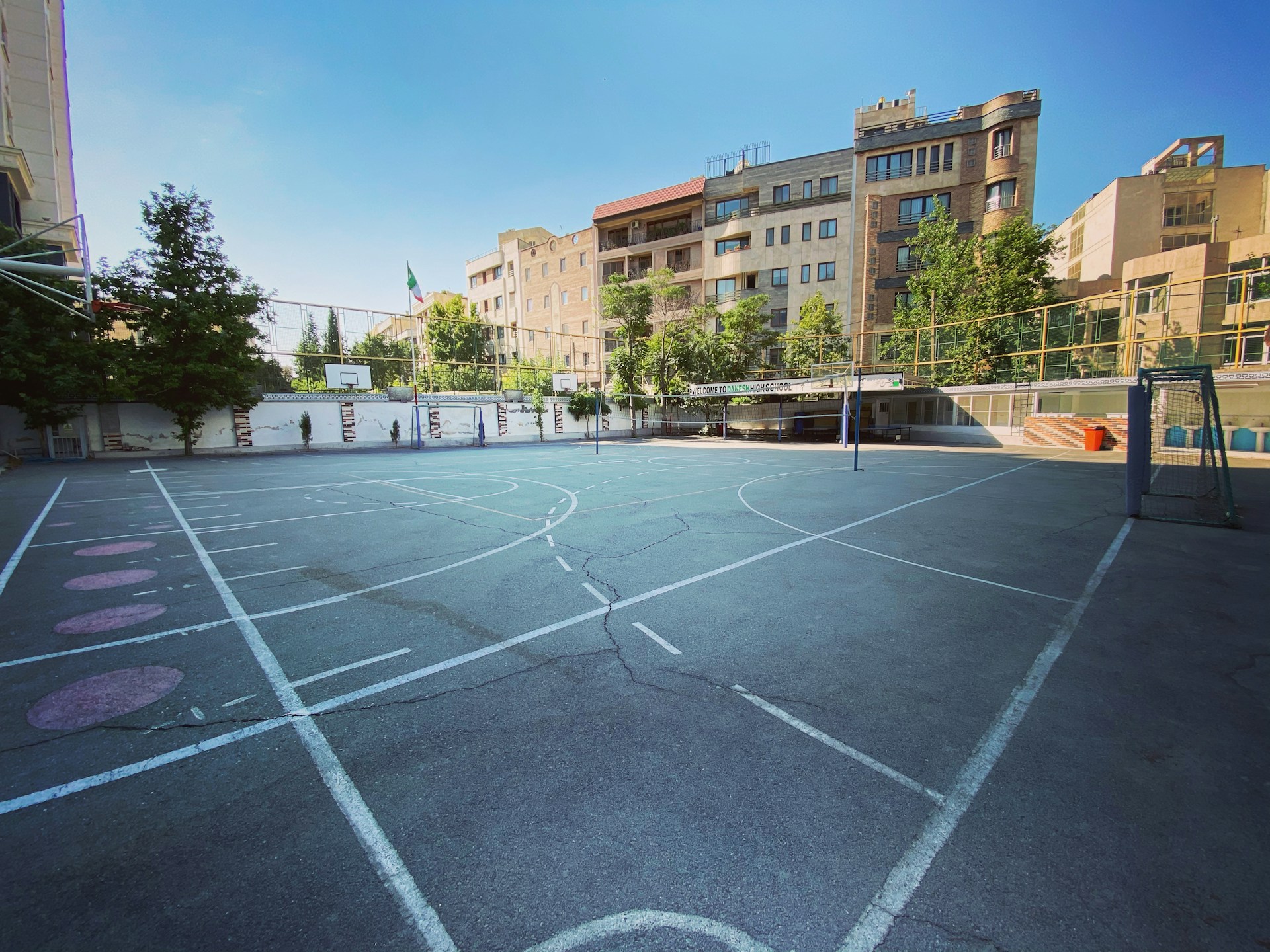 woman wearing yellow long-sleeved dress under white clouds and blue sky during daytime