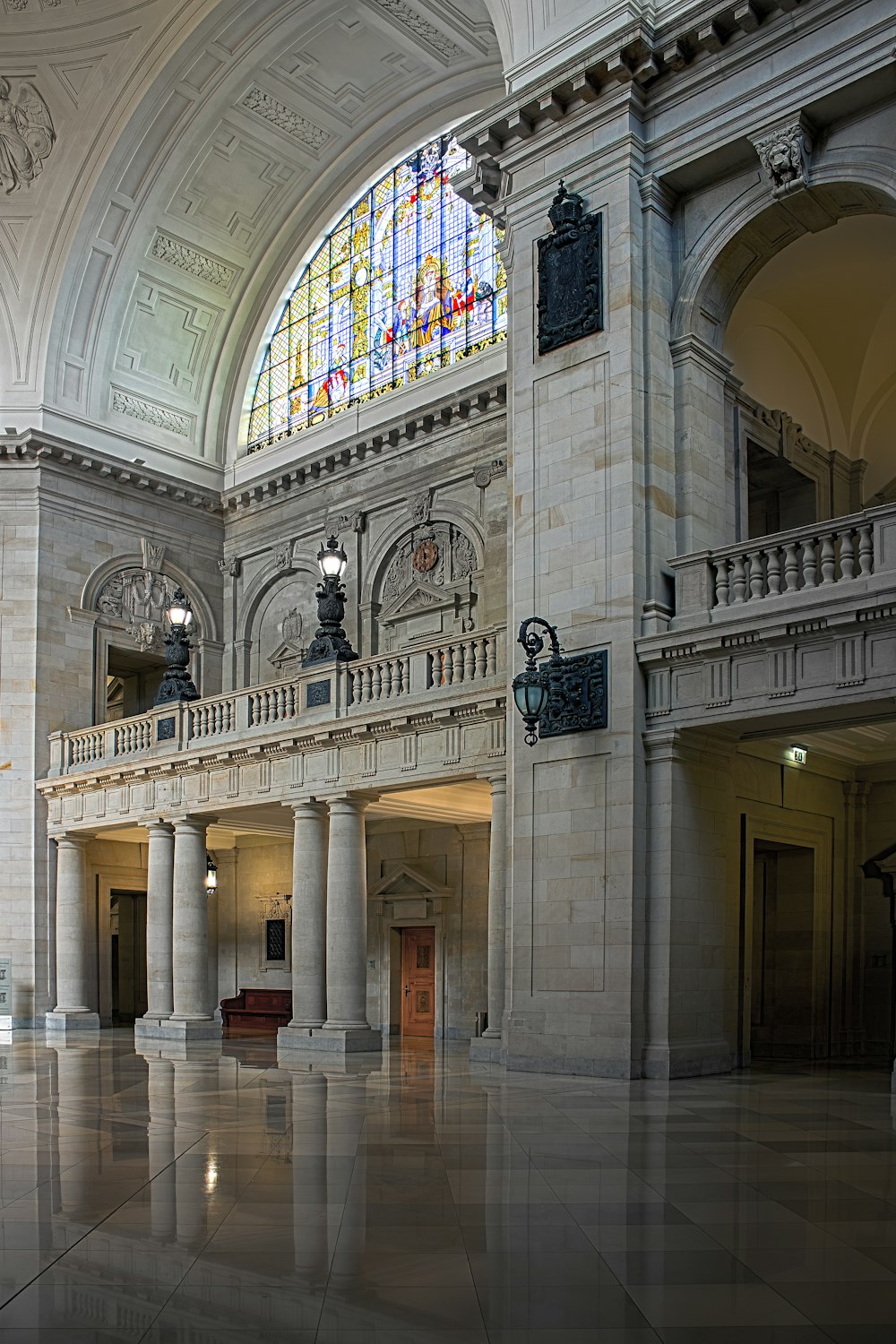 a large building with columns and stained glass windows