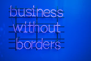 a neon sign that says business without borders