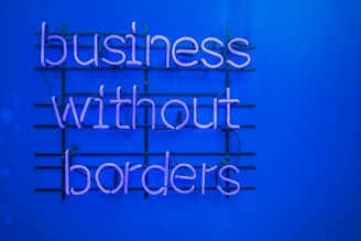 a neon sign that says business without borders