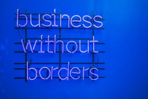 a neon sign that says business without borders