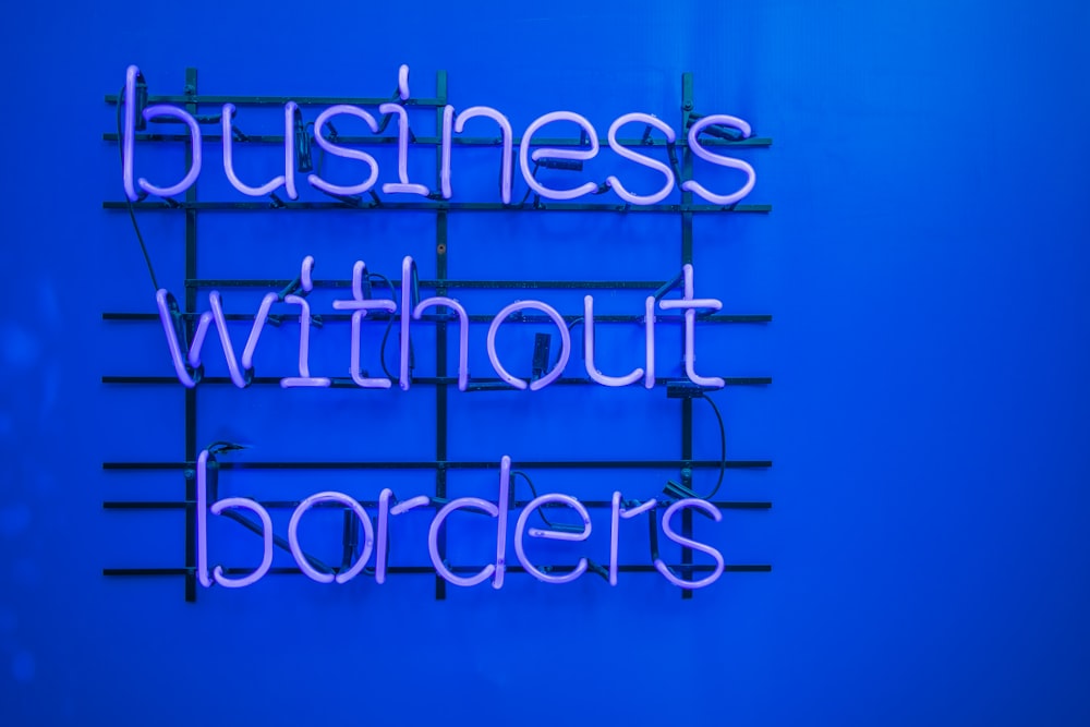 a neon sign that says business without borders