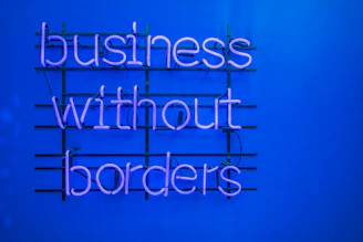 a neon sign that says business without borders