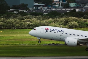 a large passenger jet taking off from an airport runway