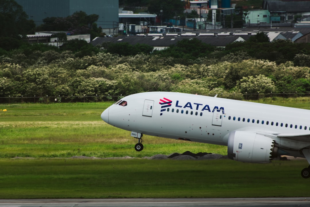 a large passenger jet taking off from an airport runway,