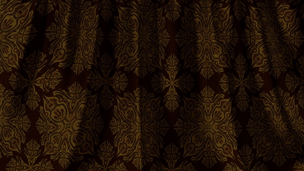 a brown and gold wallpaper with a pattern on it