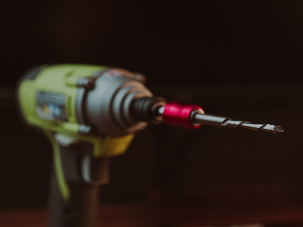 a cordless drill is being used to drill a piece of wood