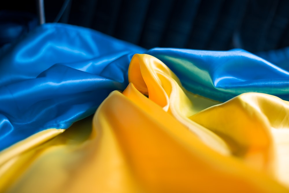 a close up of a blue and yellow cloth