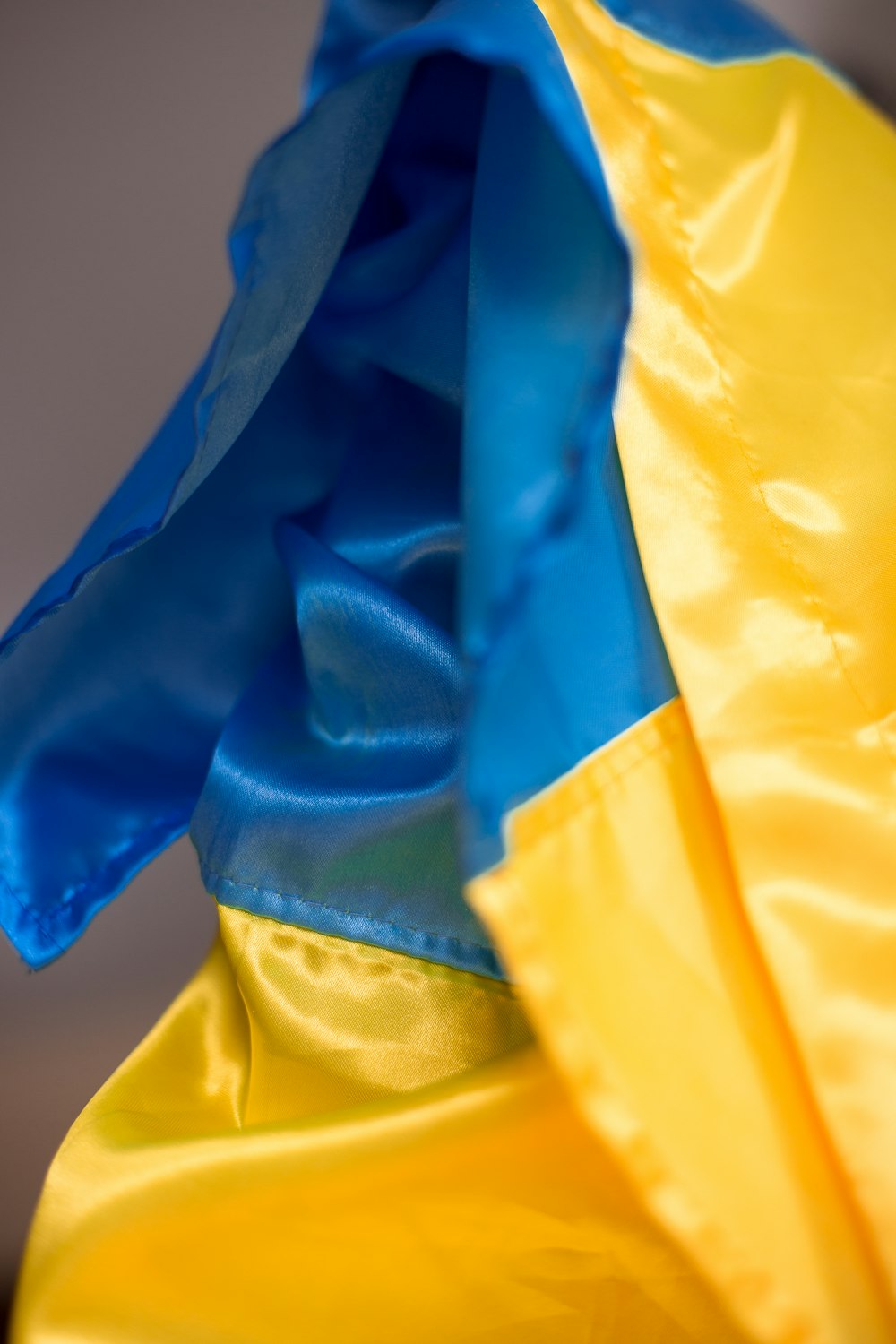 a close up of a blue and yellow umbrella