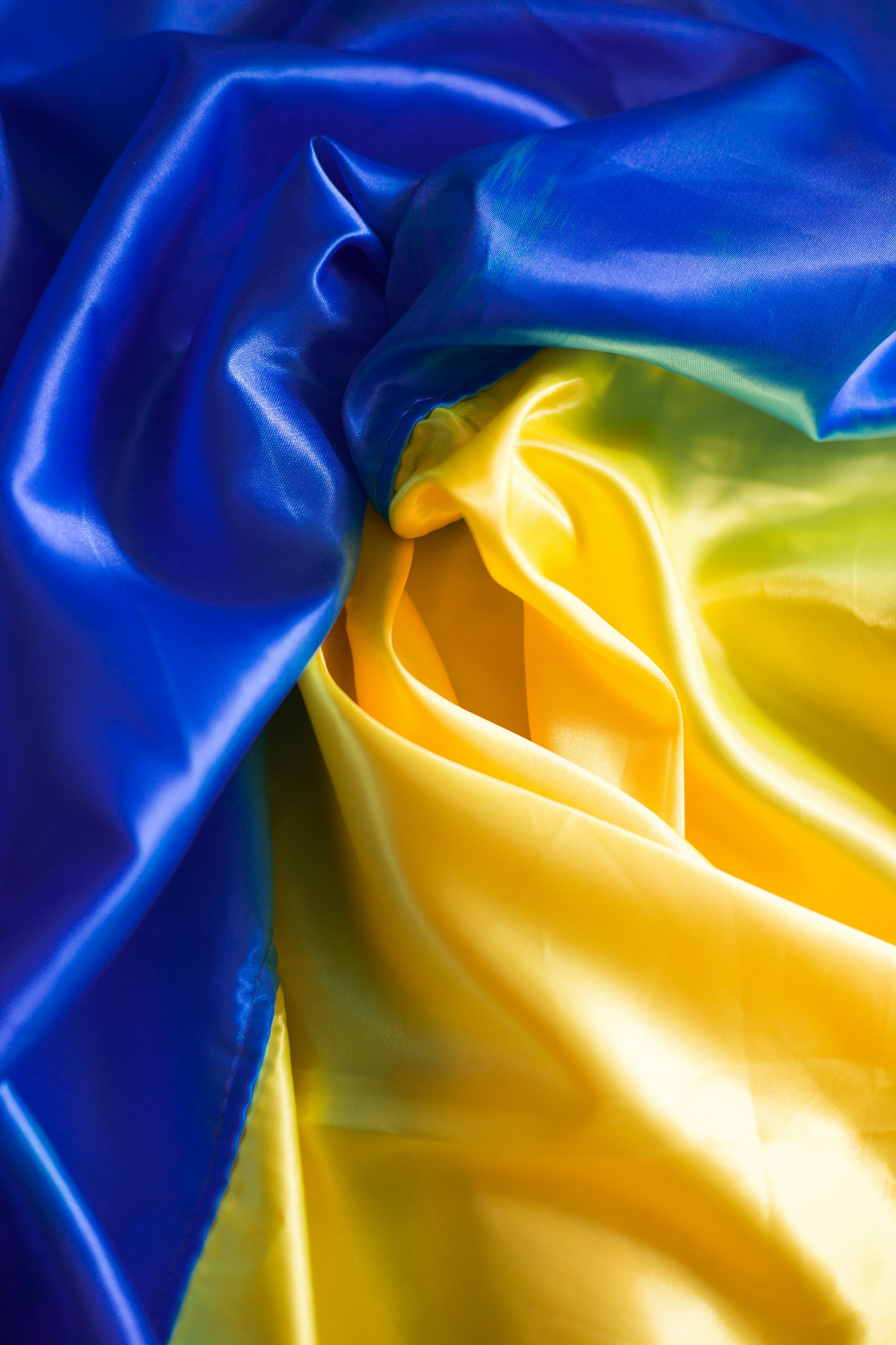 a blue and yellow fabric with a white background
