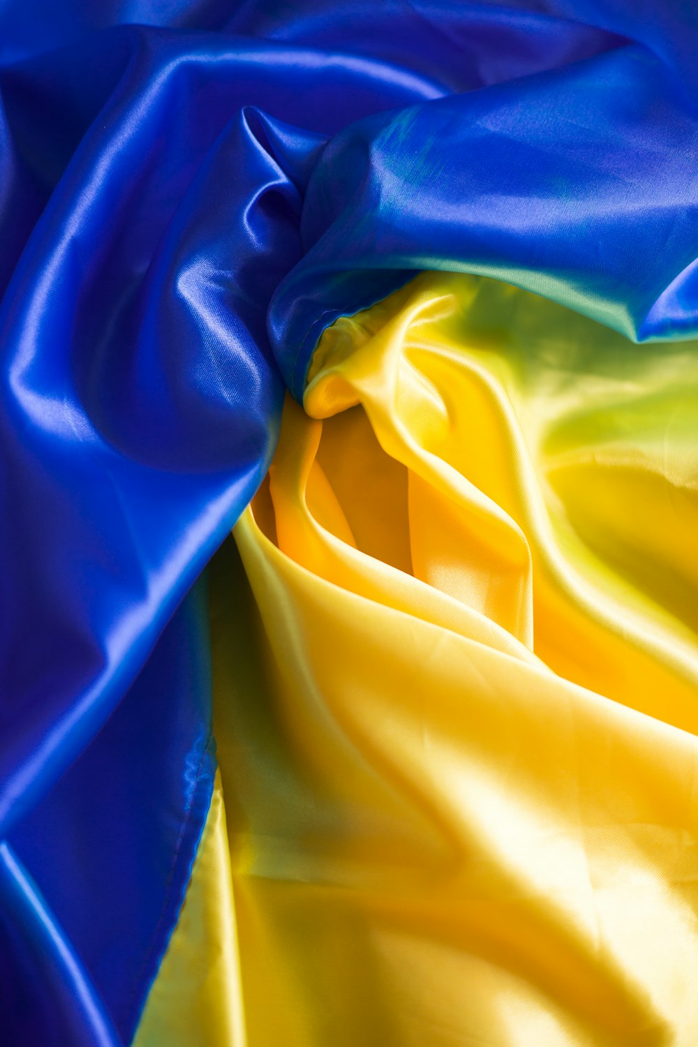 a blue and yellow fabric with a white background