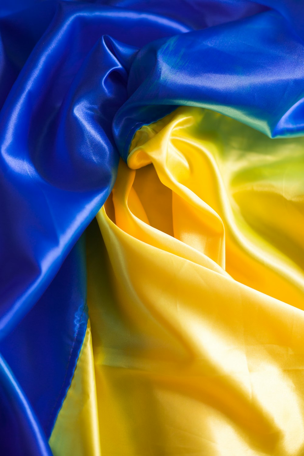 a close up of a blue and yellow fabric