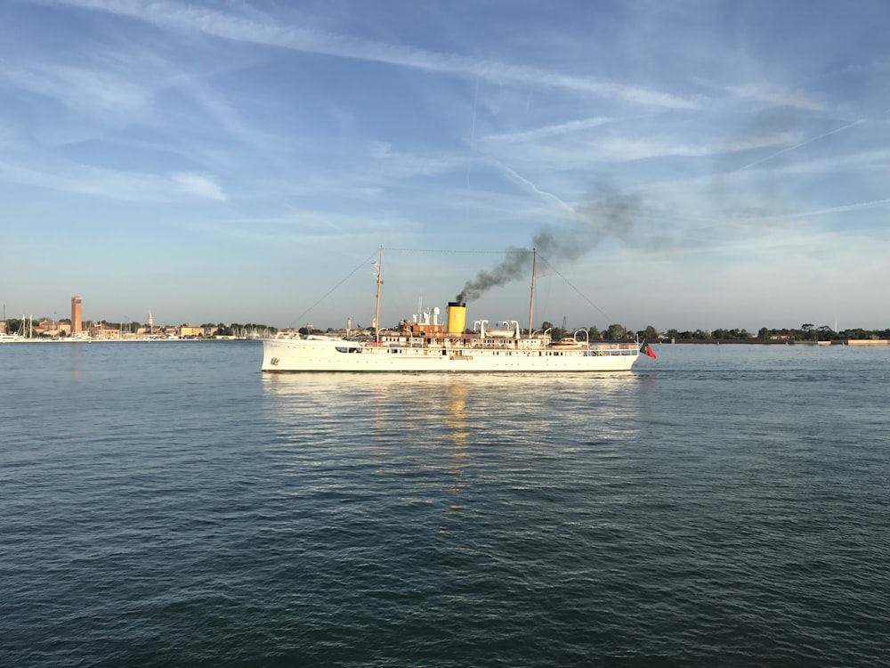 a large boat floating on top of a body of water