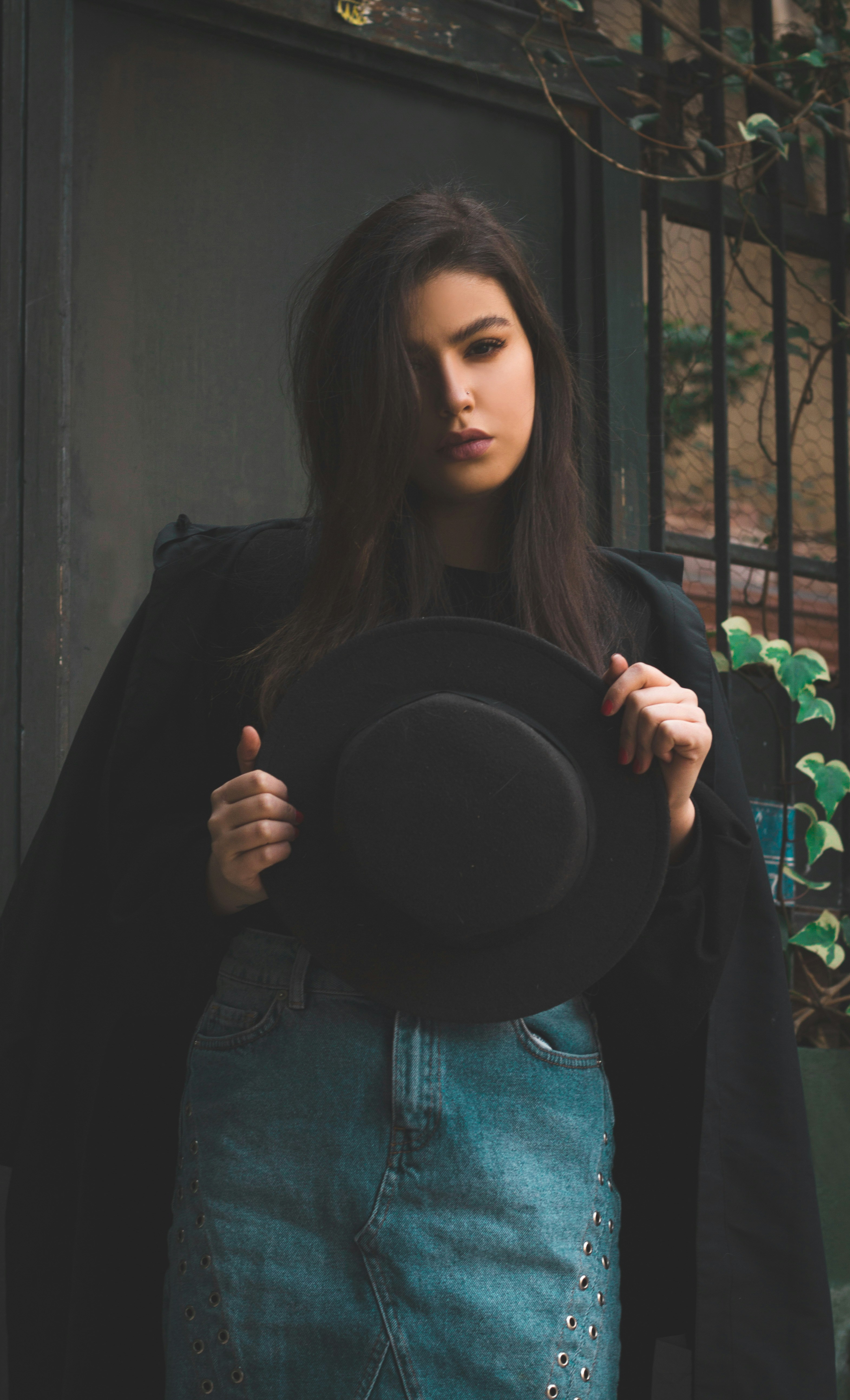 A woman in a black jacket and a black hat photo – Free Fashion Image on ...