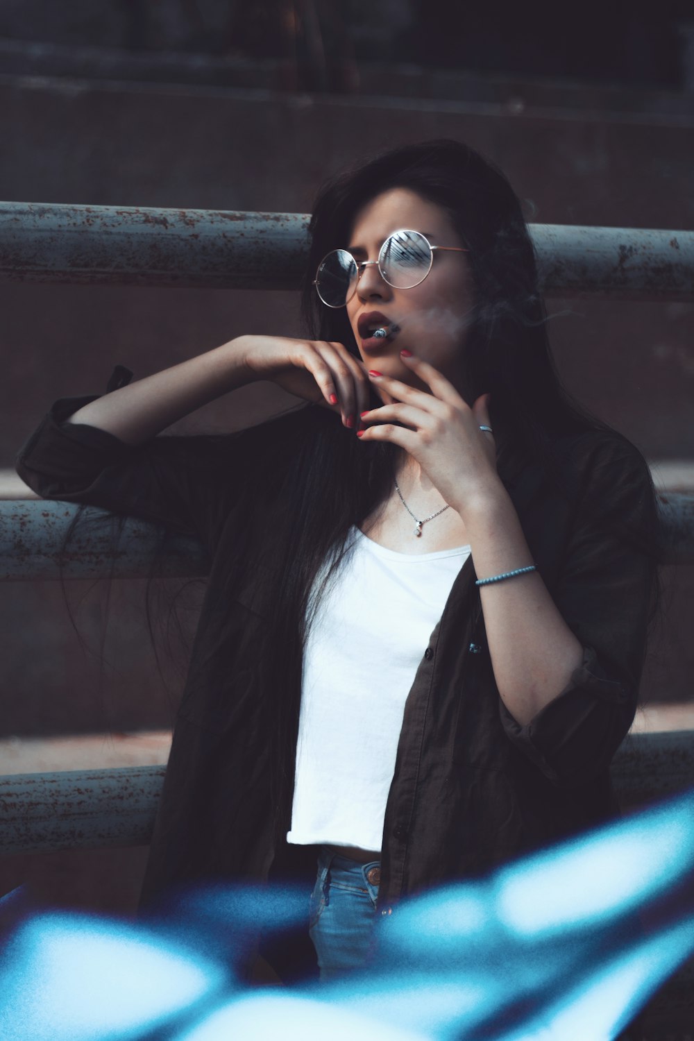 a woman with sunglasses on talking on a cell phone