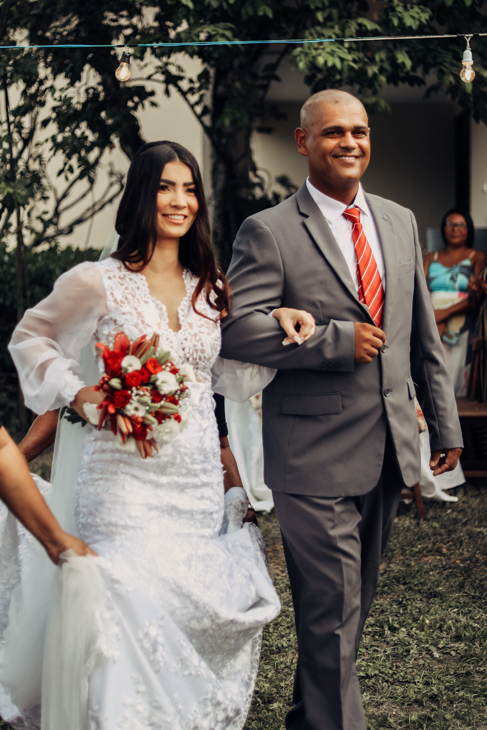 a bride and groom walking down the aisle