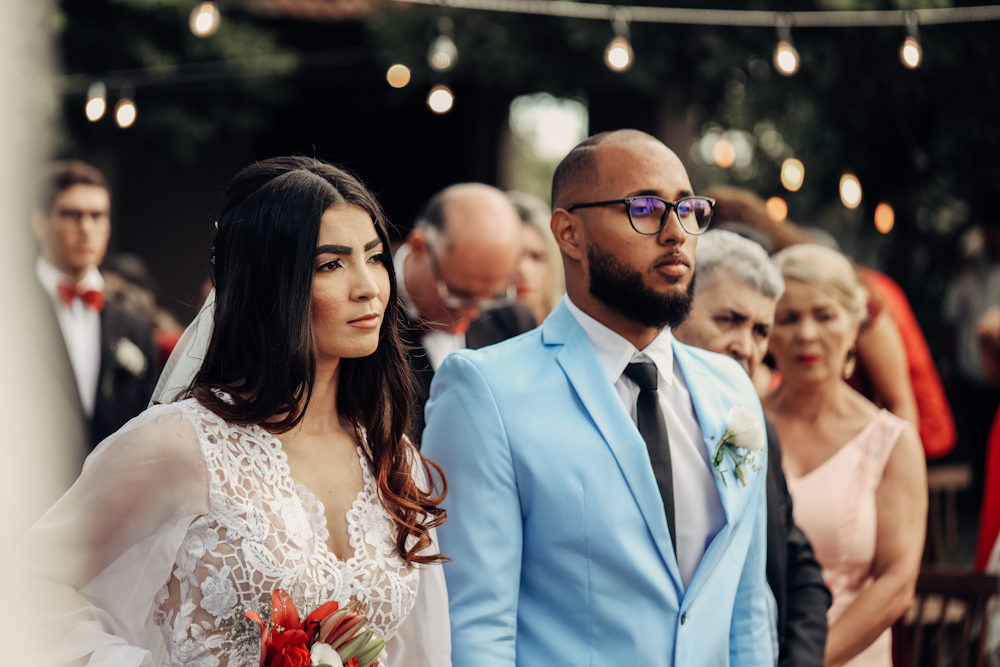 a bride and groom walking down the aisle