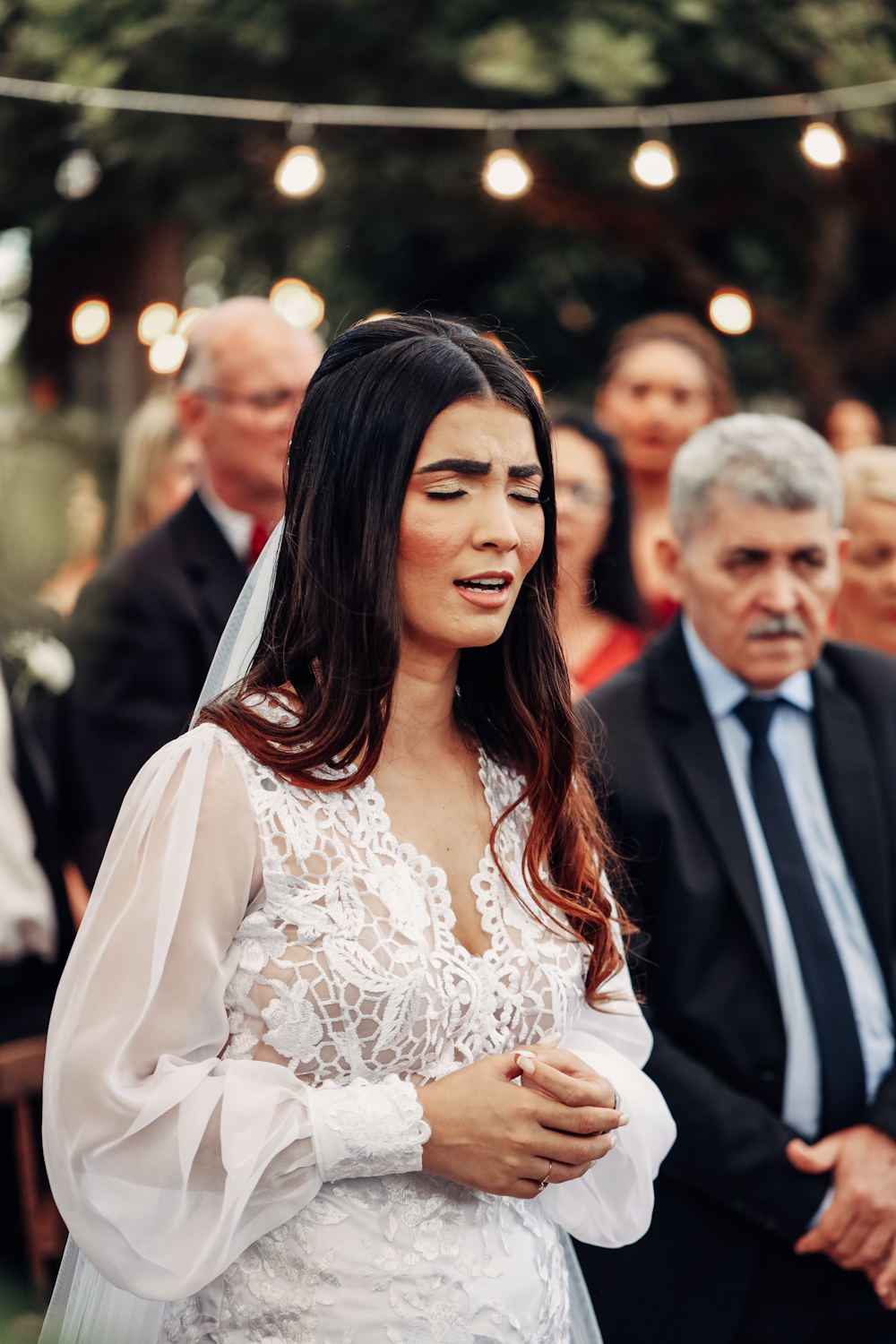 a woman standing in front of a crowd of people