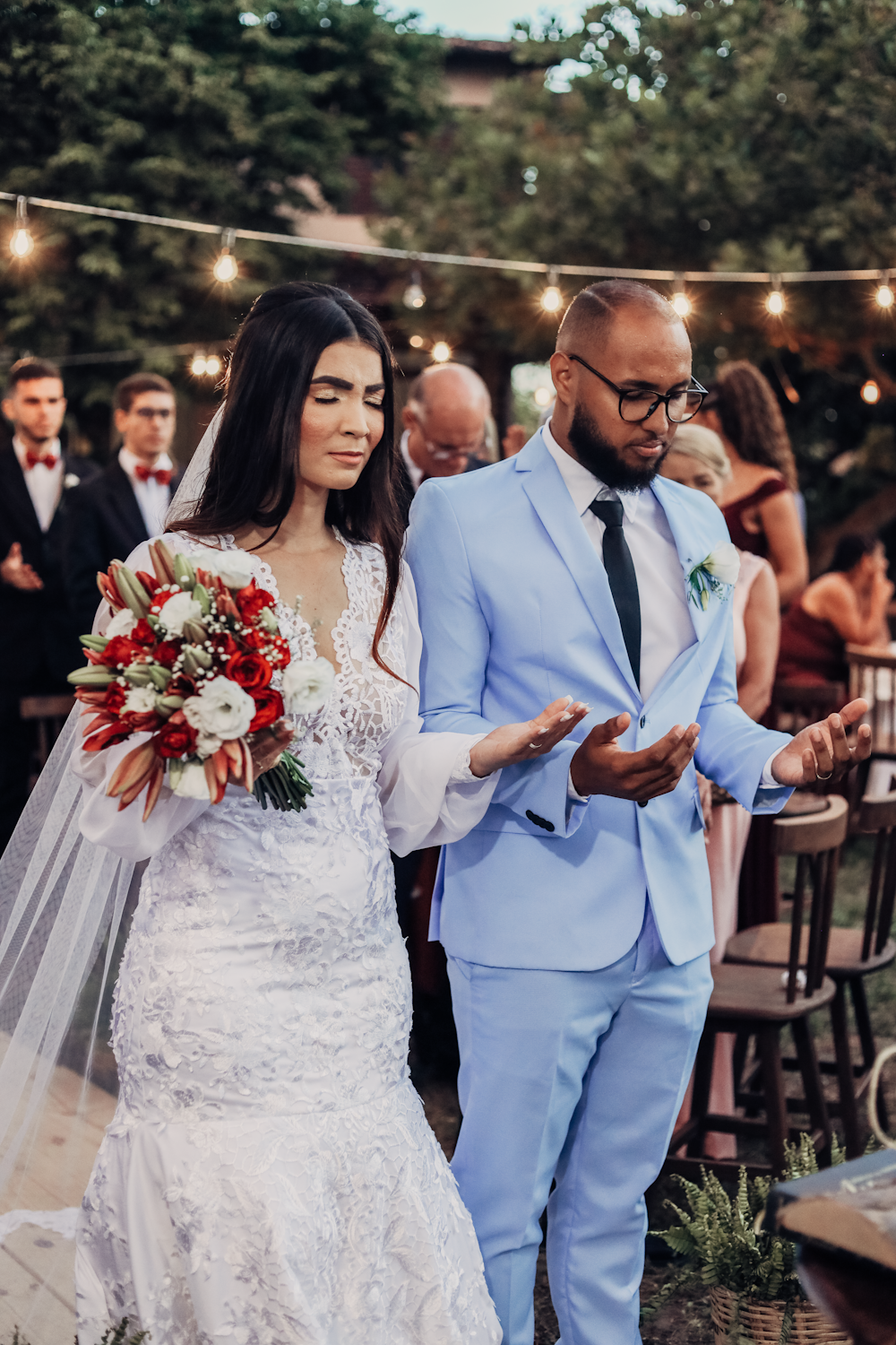 a bride and groom walking down the aisle