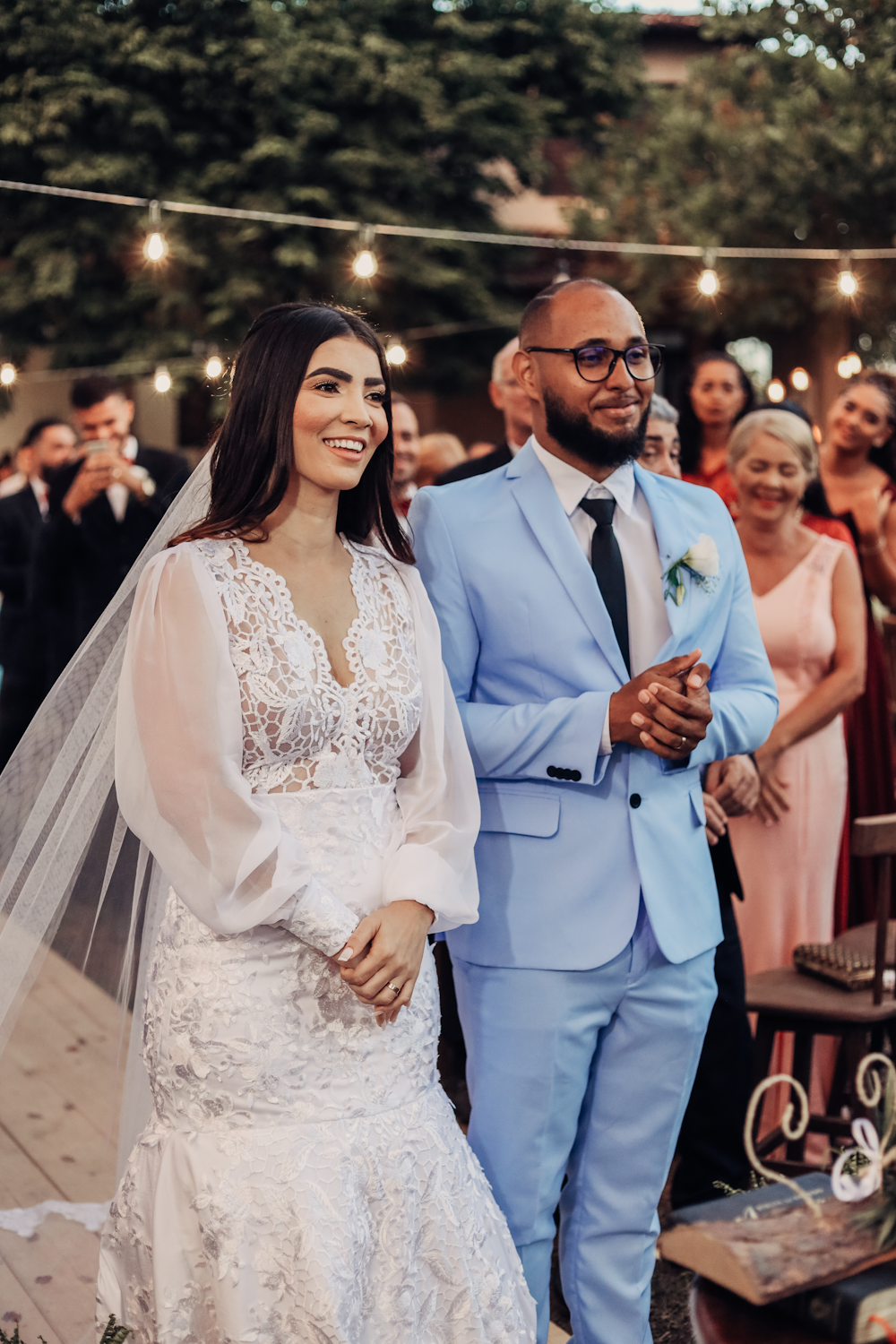 a bride and groom walking down the aisle