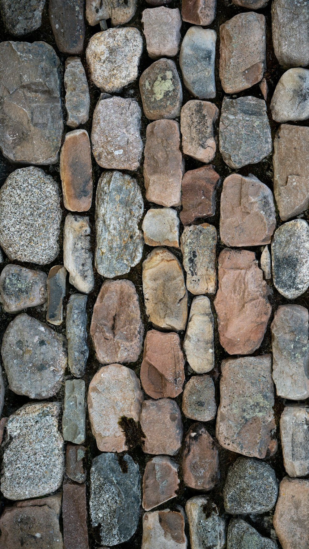 a close up of a wall made of rocks