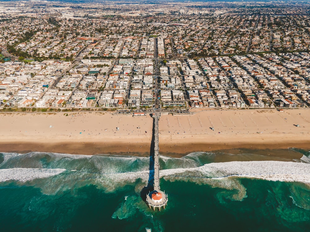 an aerial view of a beach and a city