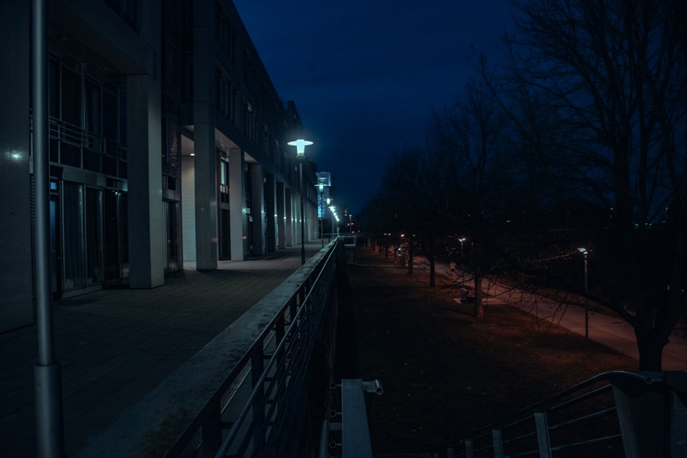 a dark city street at night with street lights