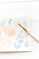 Close-up of a delicate watercolor floral design with soft pastel hues.