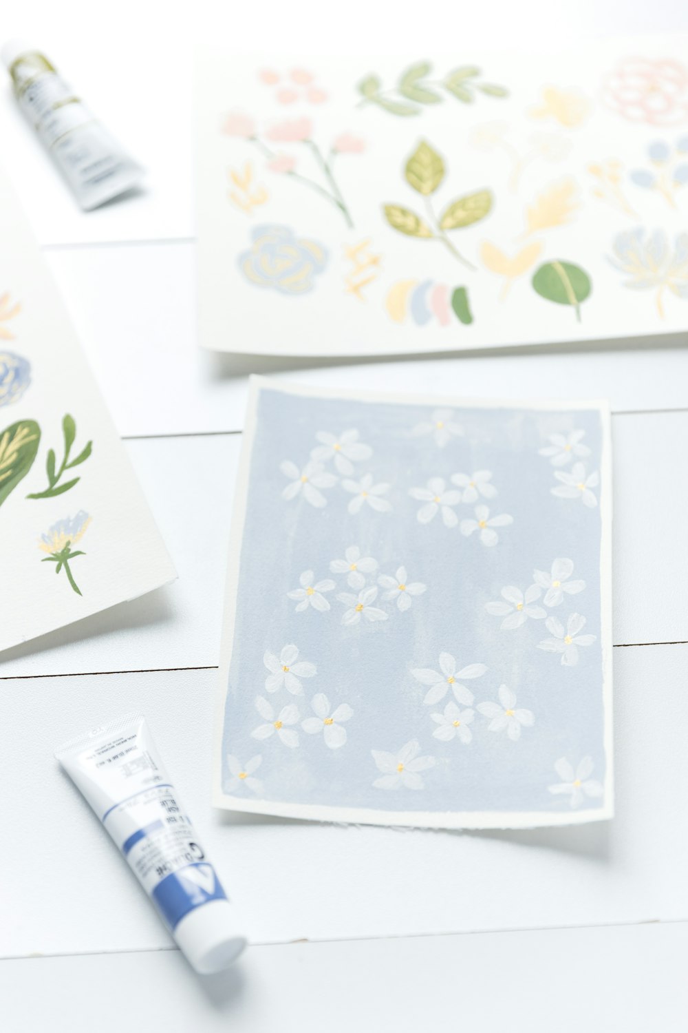 a white table topped with cards and markers