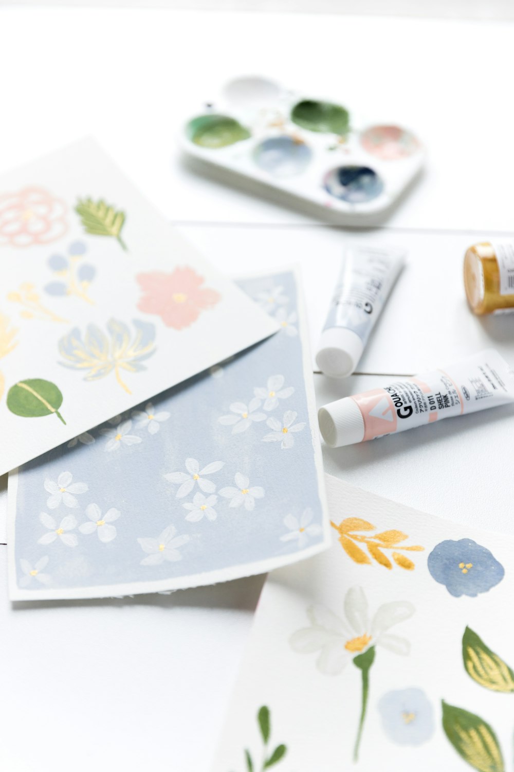 a white table topped with lots of cards and markers