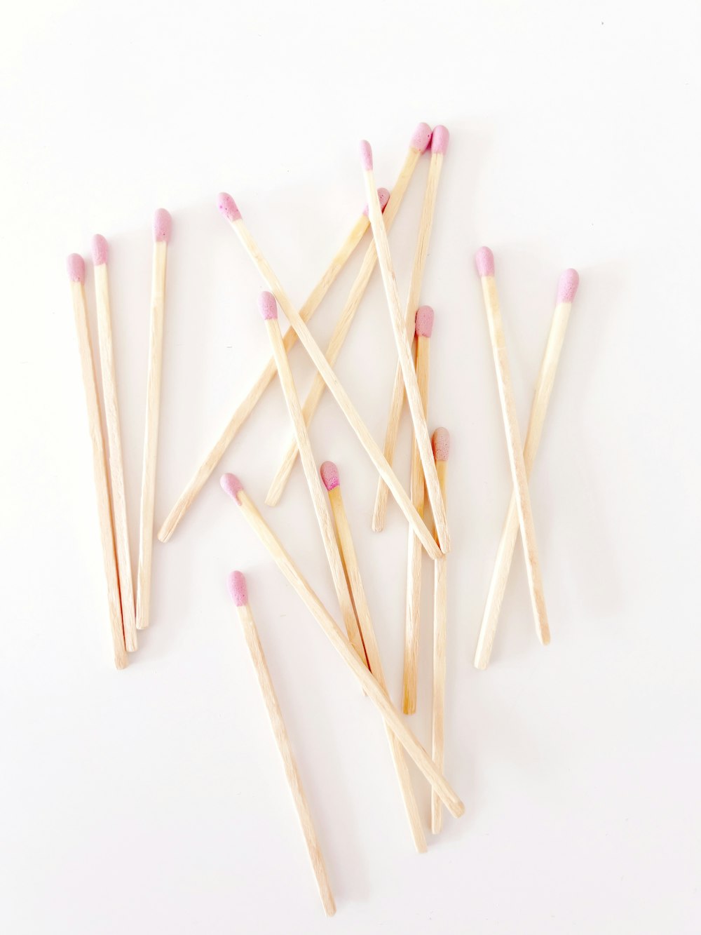 a group of matches on a white background