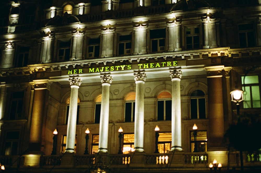 the front of a building lit up at night