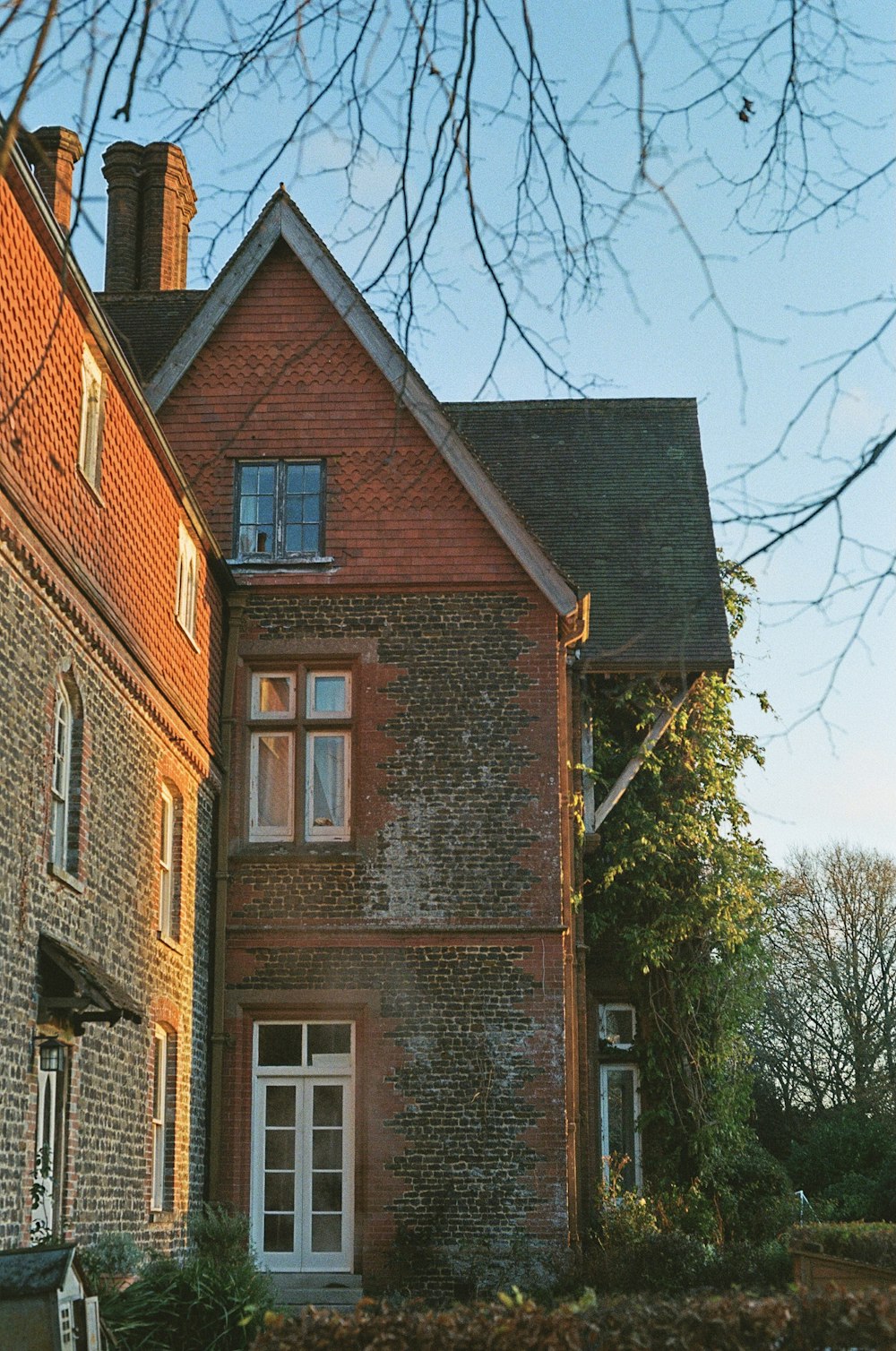 a large brick building with a clock on the front of it