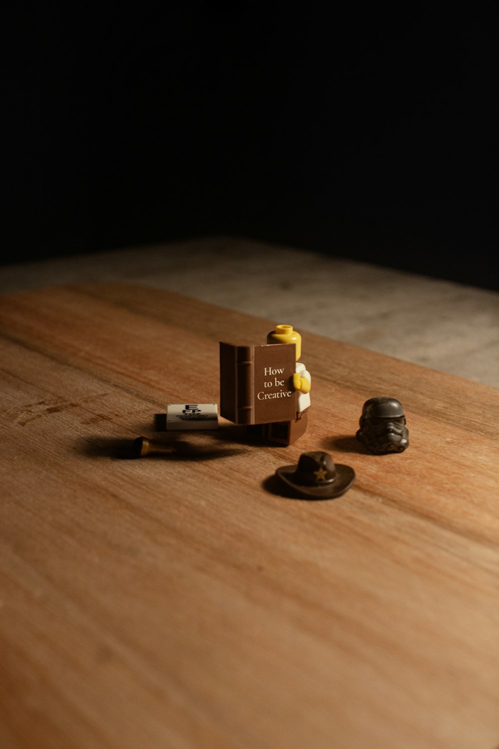 a wooden table topped with a couple of legos