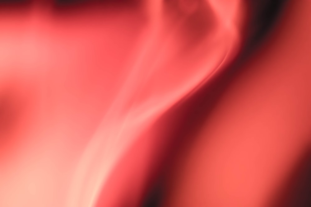 a blurry image of a red and black background