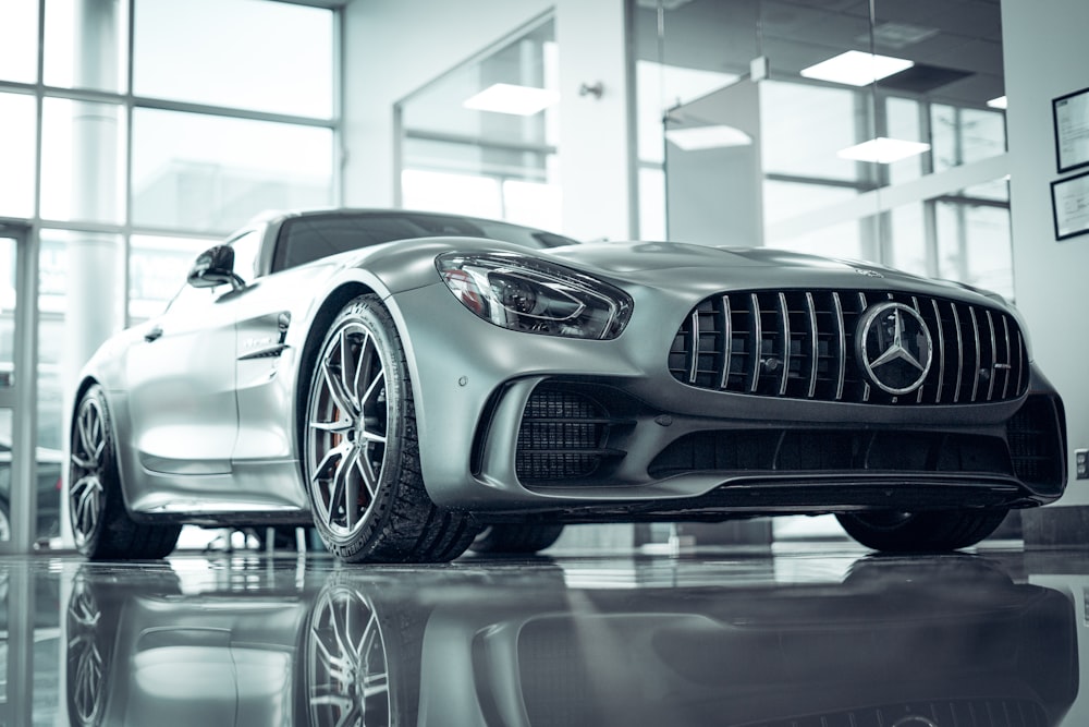 a silver car parked in front of a building