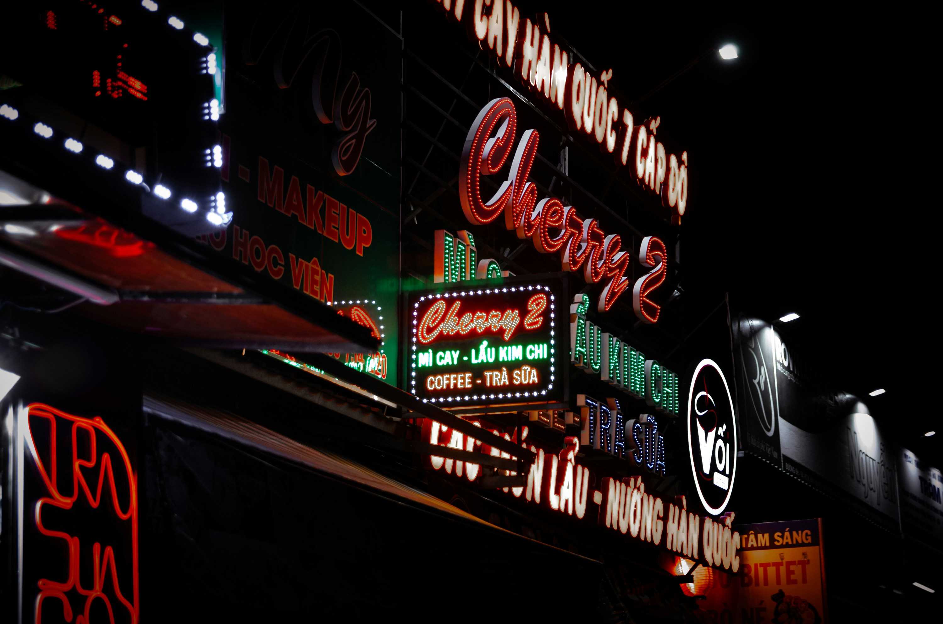 a bunch of signs that are on the side of a building