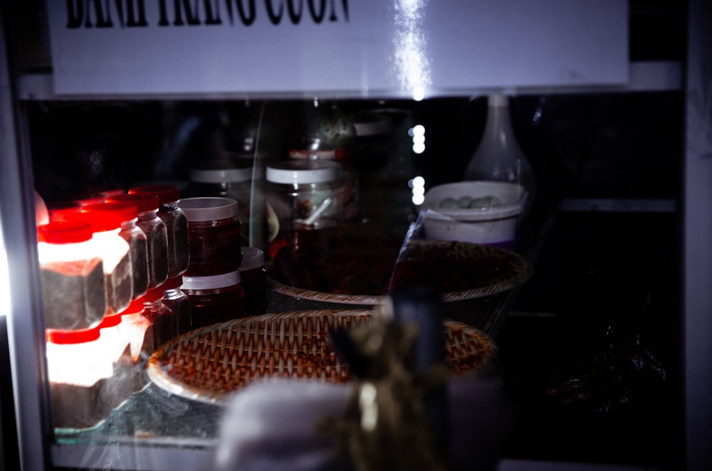 a display case filled with lots of different types of condiments