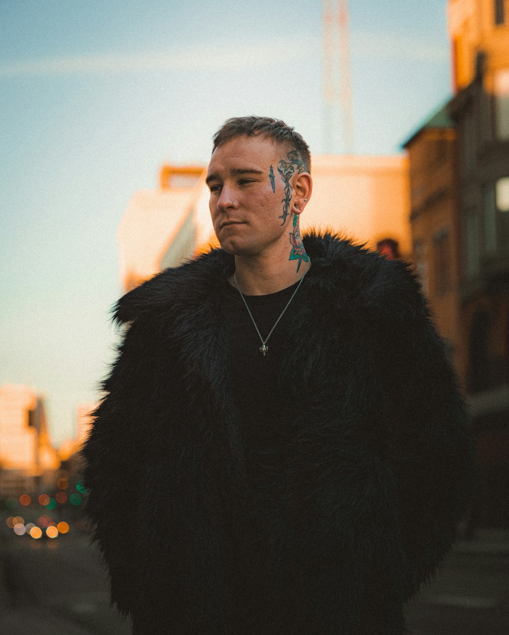 a man in a fur coat standing on a street