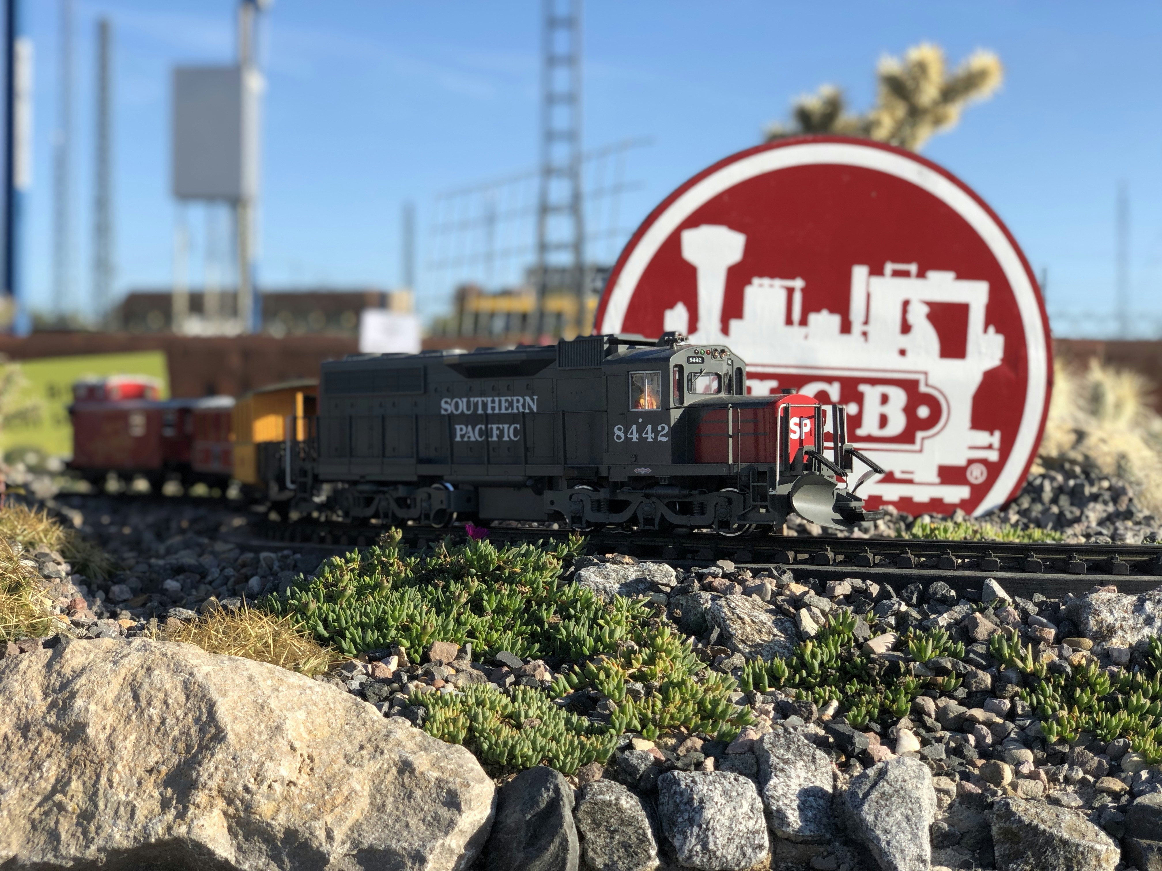 [SUGGESTED IMAGE: Dehumidifier setup in a model railway room with humidity gauge visible]