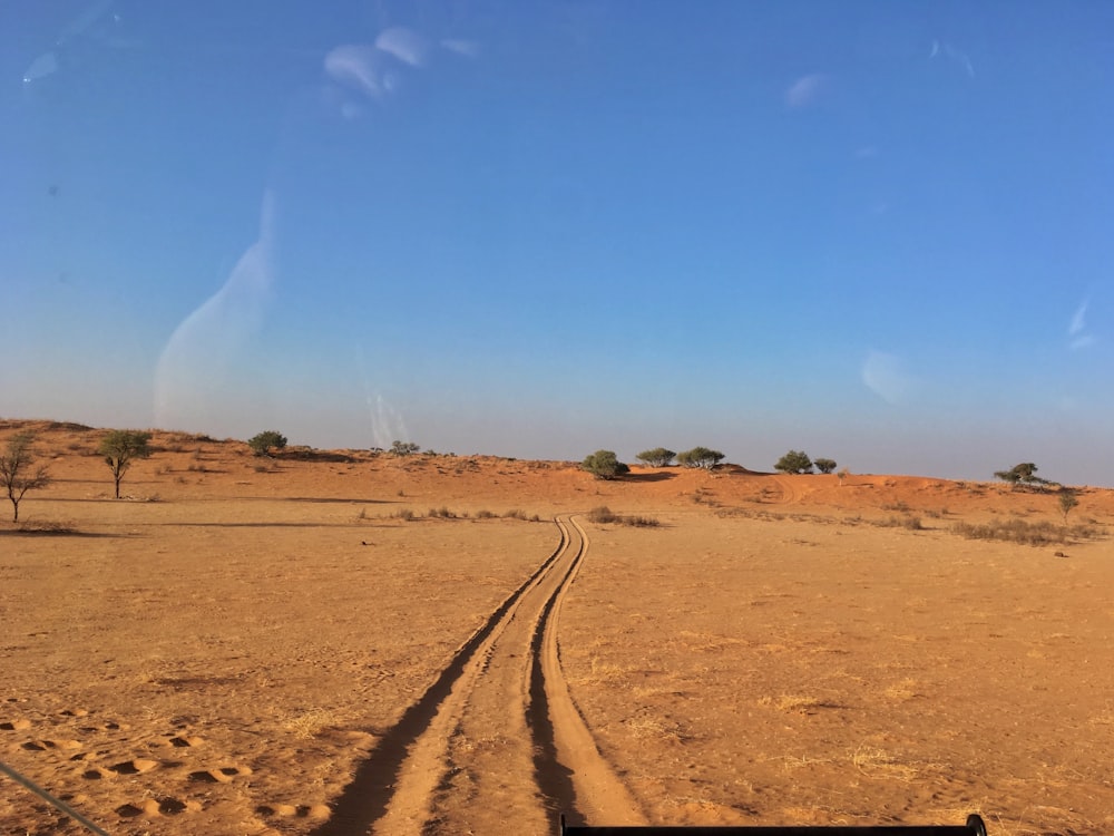 a train track in the middle of a desert