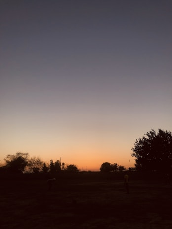 A serene sunset shot over a mountain village captured by Jami & Kim during their travels.