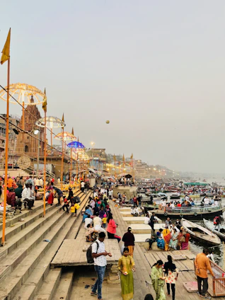 a group of people standing on top of a pier