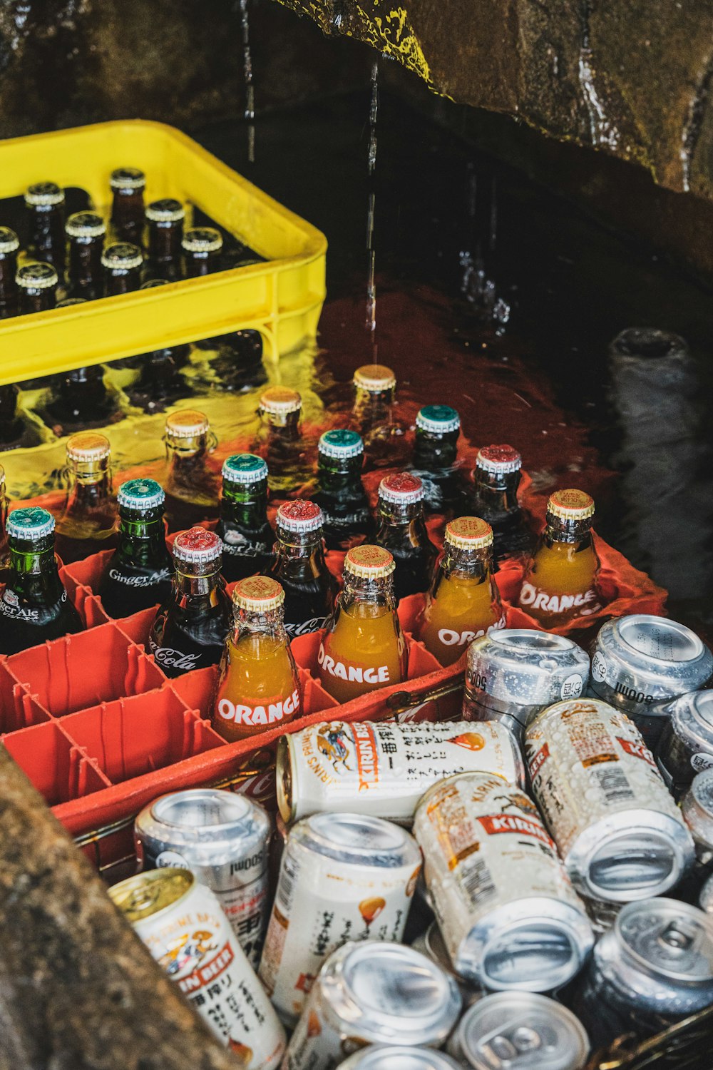 a bunch of bottles of beer sitting next to each other