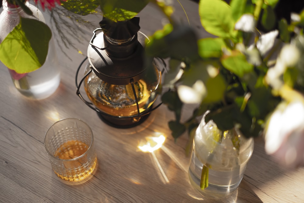 a table topped with a vase filled with flowers