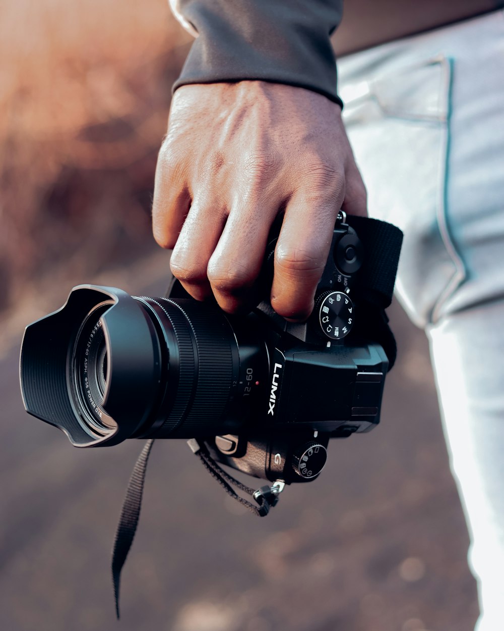 a person holding a camera in their hand