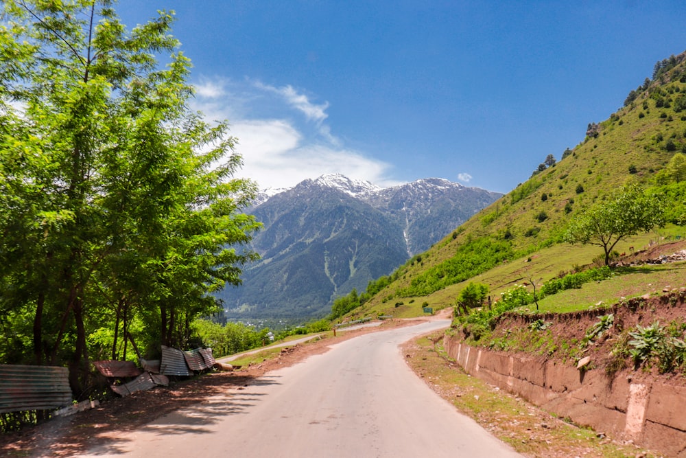 a road with a bench on the side of it